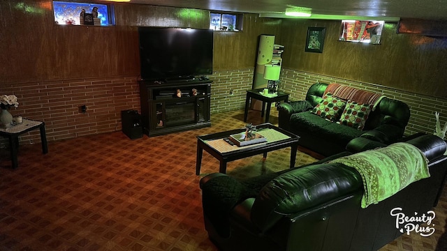 living room with brick wall and wooden walls