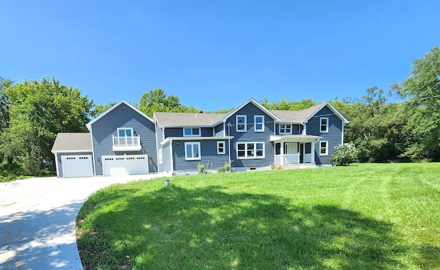 view of front of property with a garage and a front yard