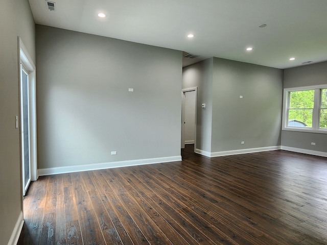 spare room with dark hardwood / wood-style flooring