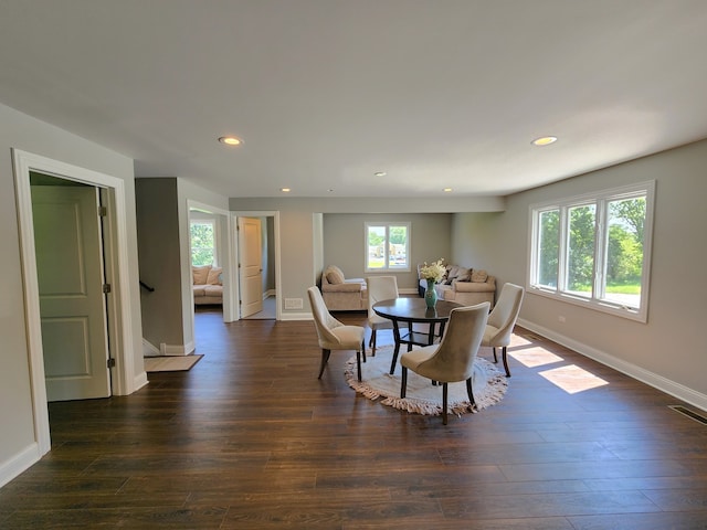 dining space featuring dark hardwood / wood-style floors