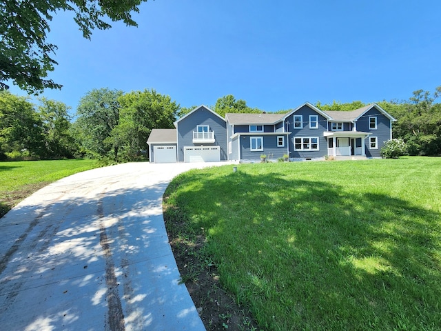 view of front facade featuring a garage and a front lawn