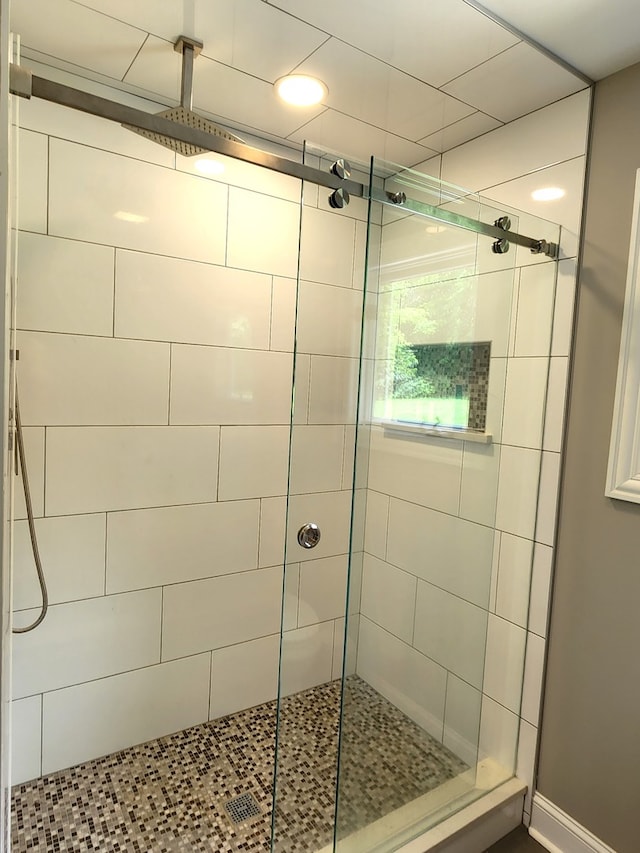 bathroom featuring an enclosed shower