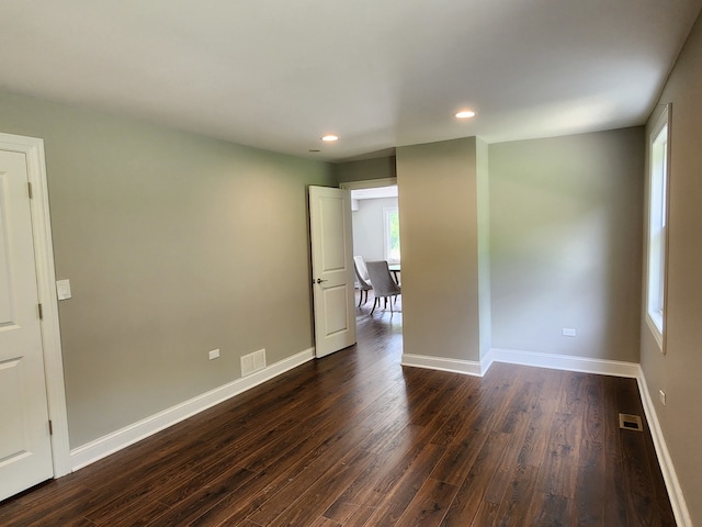 spare room with hardwood / wood-style floors