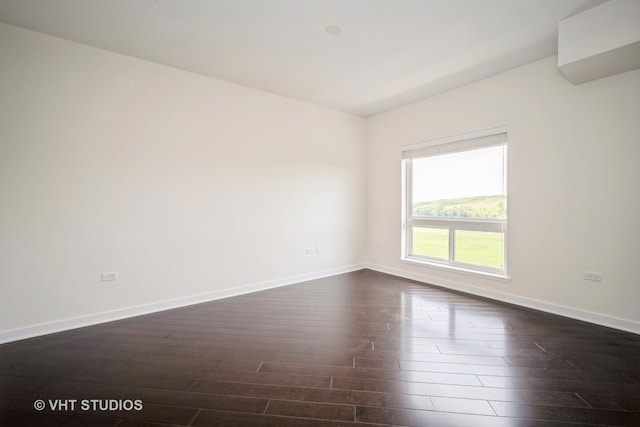 unfurnished room featuring hardwood / wood-style floors