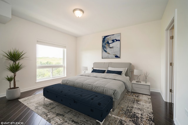 bedroom featuring dark hardwood / wood-style flooring