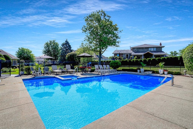 view of pool featuring a patio, fence, and a fenced in pool