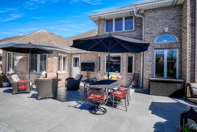 view of patio featuring outdoor dining area