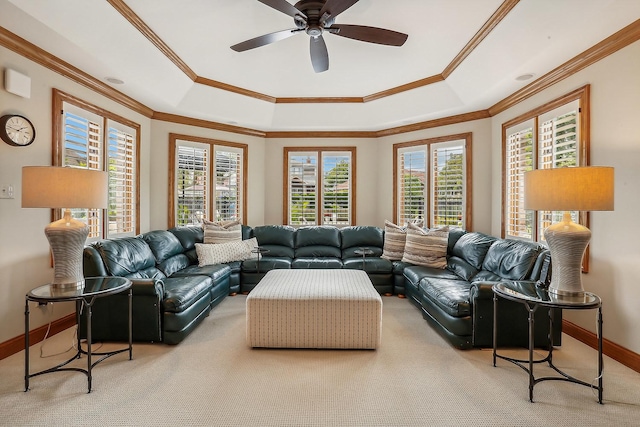 living area featuring ornamental molding, carpet, and a healthy amount of sunlight