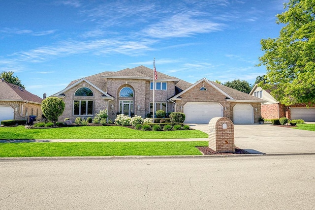 view of front of property featuring driveway, roof with shingles, an attached garage, a front yard, and brick siding