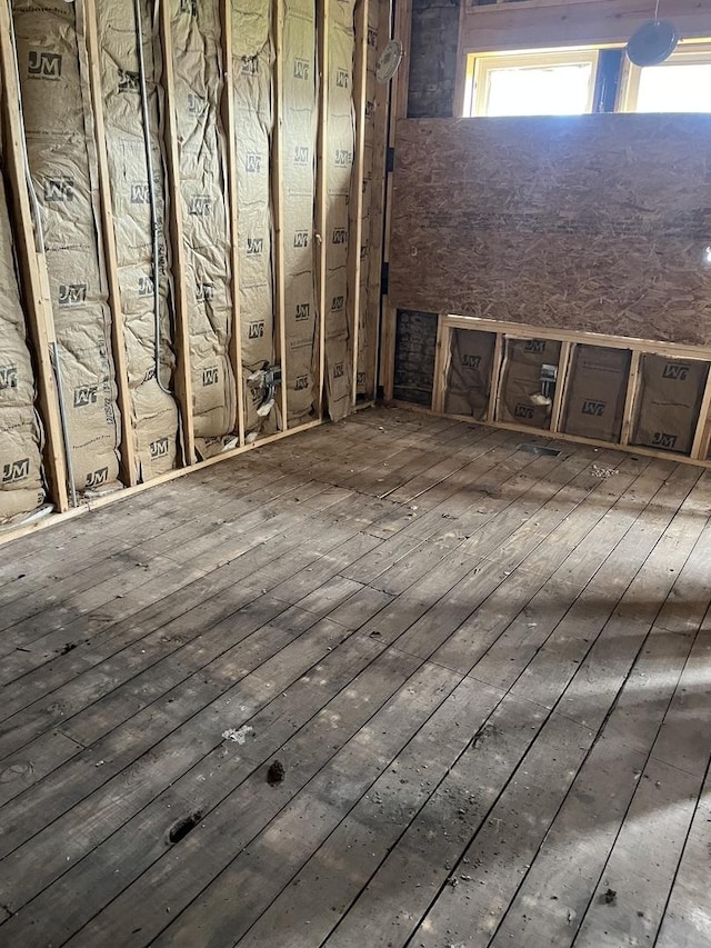 unfurnished room featuring dark wood-type flooring