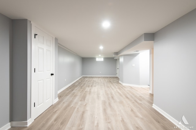 basement featuring light hardwood / wood-style flooring