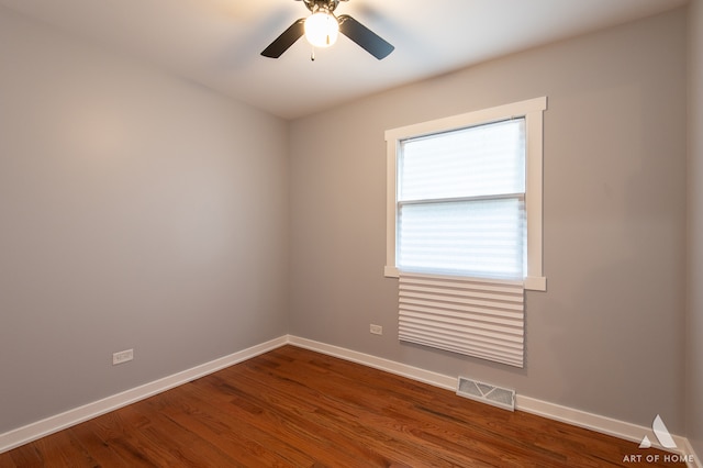 unfurnished room with ceiling fan and wood-type flooring