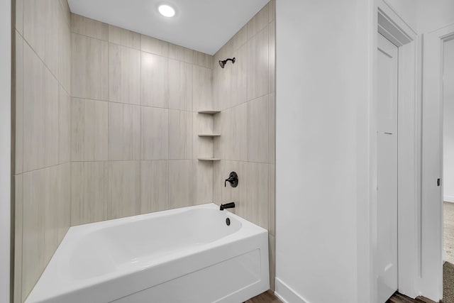 bathroom with bathing tub / shower combination