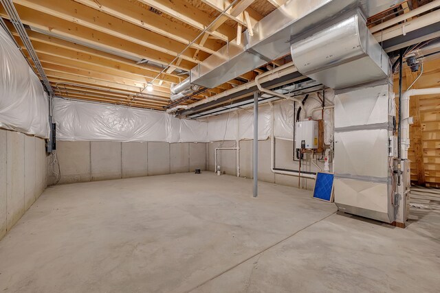 basement featuring tankless water heater