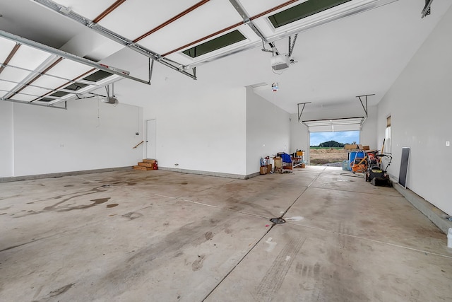 garage featuring baseboards and a garage door opener