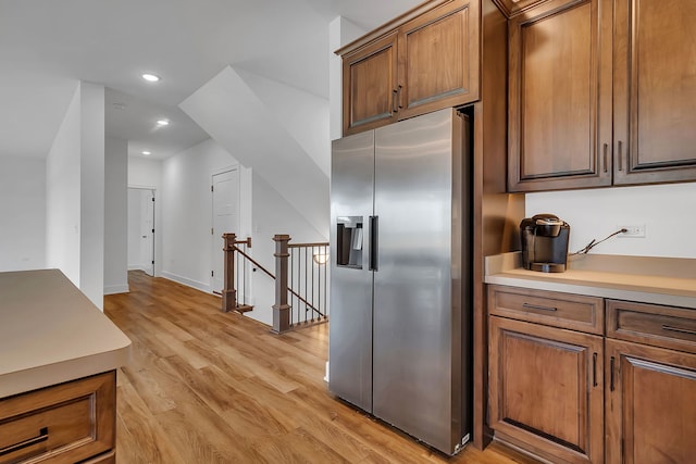 kitchen featuring light wood-type flooring and high end fridge