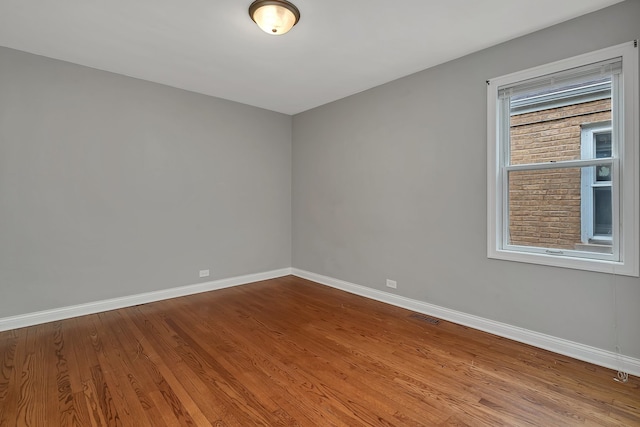 empty room featuring hardwood / wood-style floors