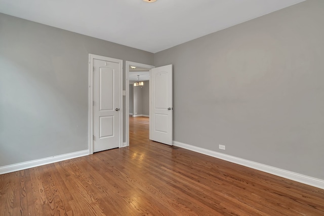 empty room featuring wood-type flooring