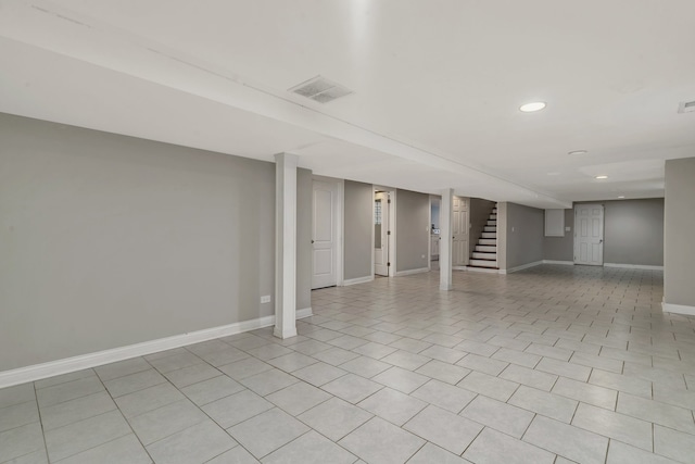 basement featuring light tile patterned floors