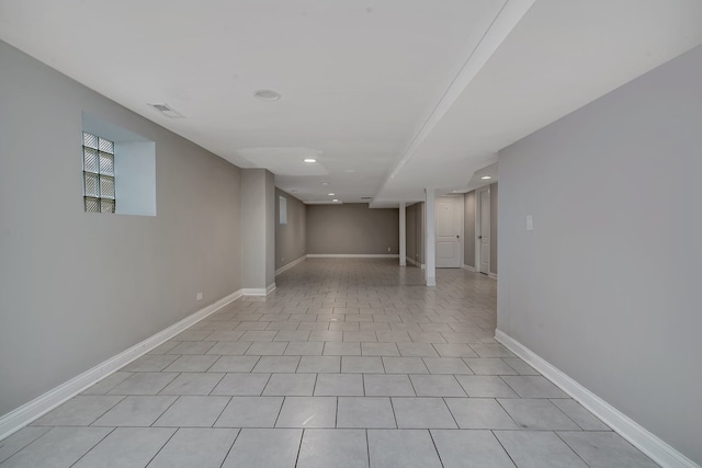 empty room with light tile patterned floors