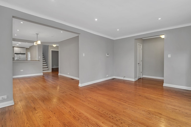 spare room featuring light hardwood / wood-style flooring