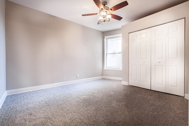 unfurnished bedroom featuring ceiling fan, carpet flooring, and a closet