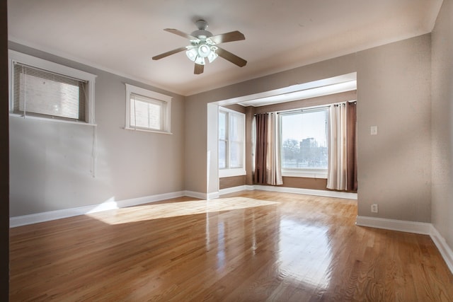 empty room with ceiling fan and light wood-type flooring