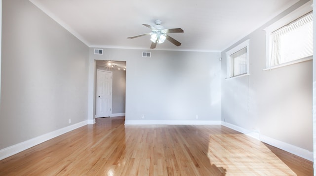 empty room with light wood-type flooring and ceiling fan