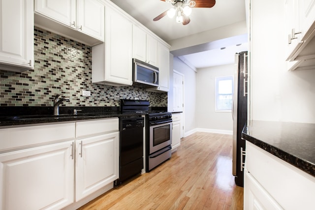 kitchen with light wood-type flooring, stainless steel appliances, ceiling fan, and white cabinetry