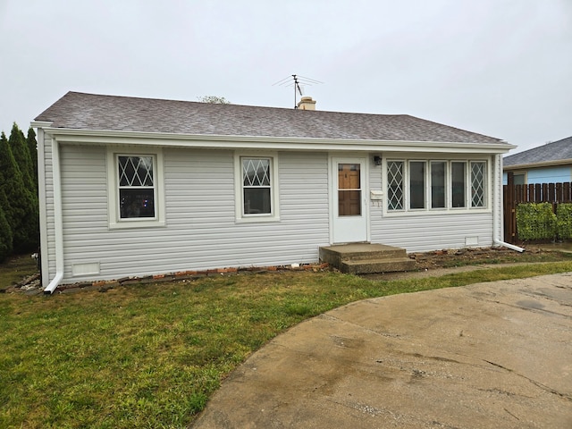 view of front of house featuring a front yard and a patio area