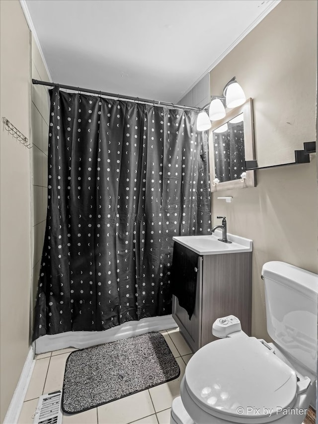 bathroom with walk in shower, vanity, and toilet