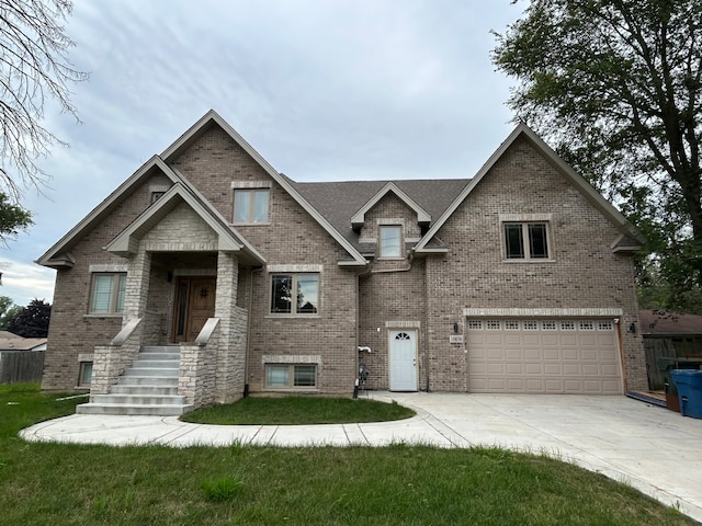 view of front of house with a garage and a front yard