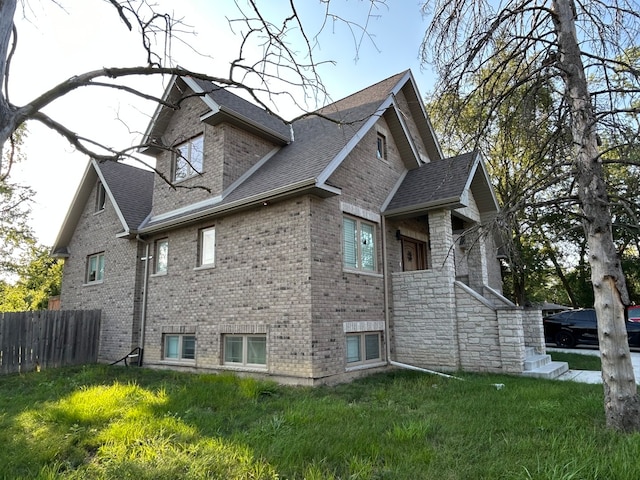 view of property exterior featuring a lawn