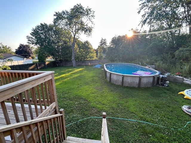 view of yard with a swimming pool side deck