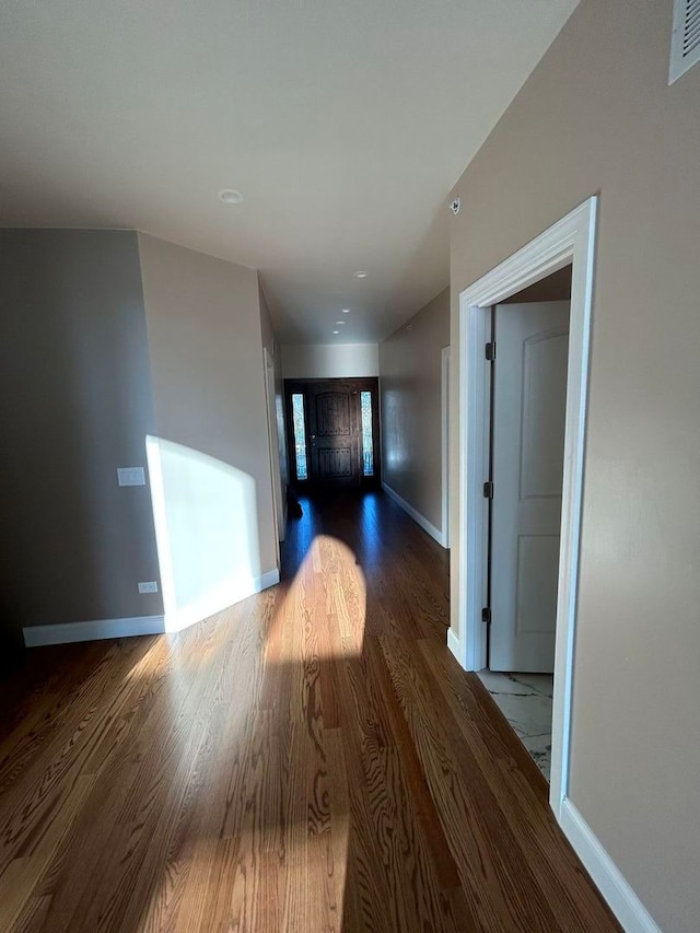 corridor featuring hardwood / wood-style floors