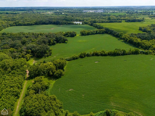 birds eye view of property with a rural view