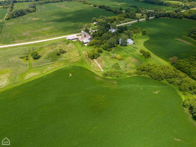 birds eye view of property with a rural view