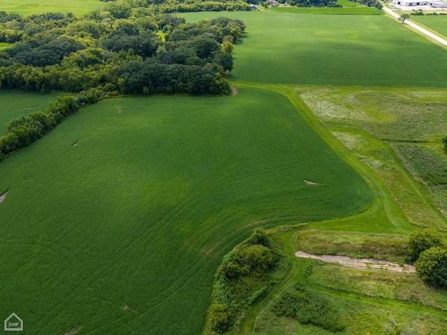 birds eye view of property with a rural view