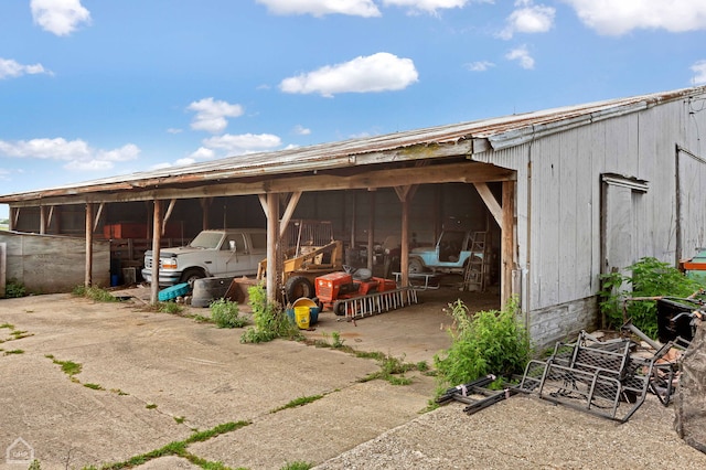 view of parking / parking lot featuring a carport and driveway