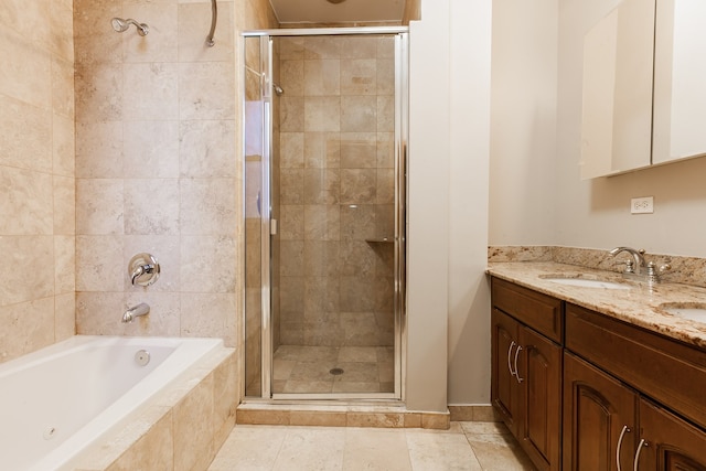 bathroom featuring shower with separate bathtub, vanity, and tile patterned flooring