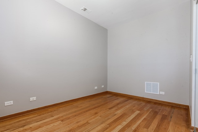 spare room with light wood-type flooring