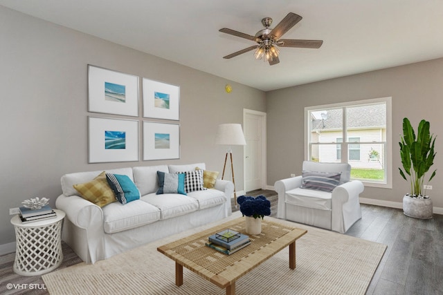 living room featuring hardwood / wood-style floors and ceiling fan