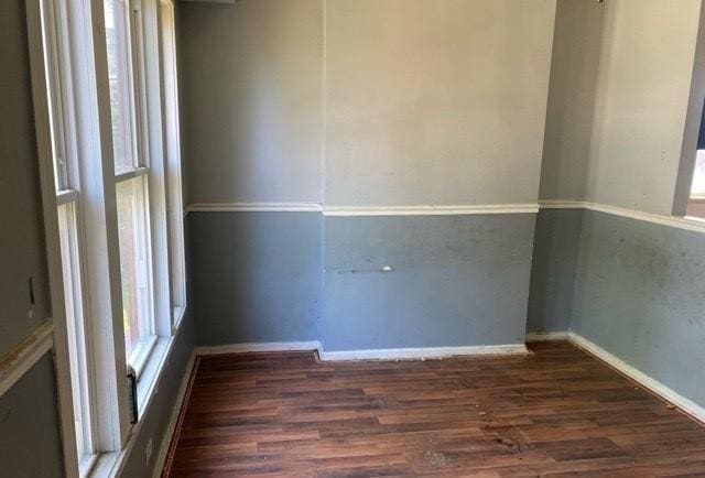 unfurnished room featuring dark hardwood / wood-style floors