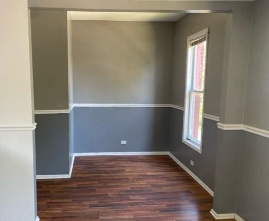 unfurnished room featuring dark hardwood / wood-style floors