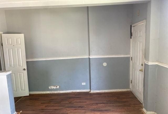 empty room featuring dark hardwood / wood-style flooring