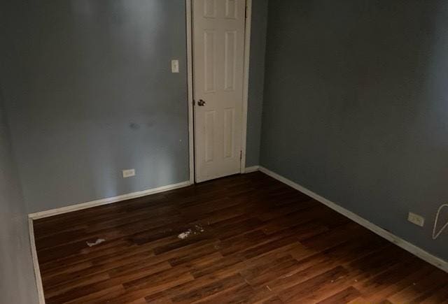 spare room featuring dark hardwood / wood-style floors