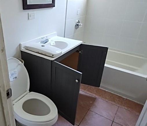 bathroom with vanity, tile patterned floors, and toilet