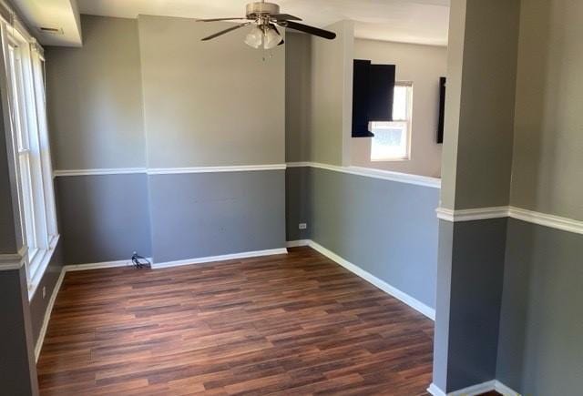 unfurnished room with dark wood-type flooring and ceiling fan