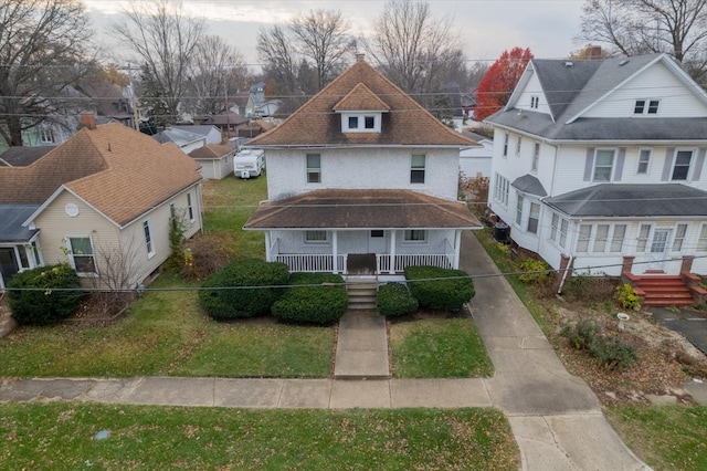 view of front of property featuring covered porch