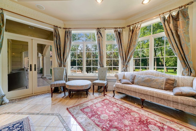 living area with recessed lighting, french doors, and ornamental molding